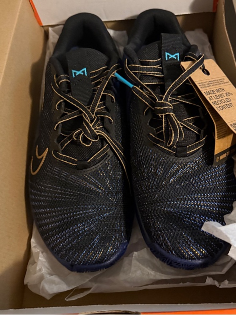 Nike Men's Black Sneakers with Gold Stitching and Teal Accents